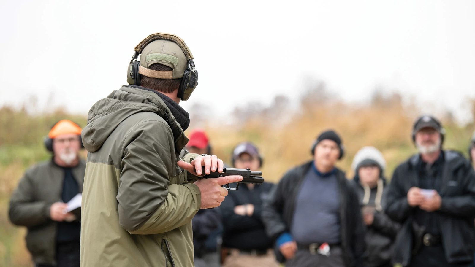 A USCCA instructor demonstrating a pistol to a training class